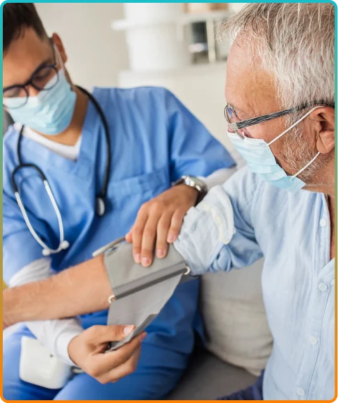Healthcare professional performing a blood pressure check on a senior.